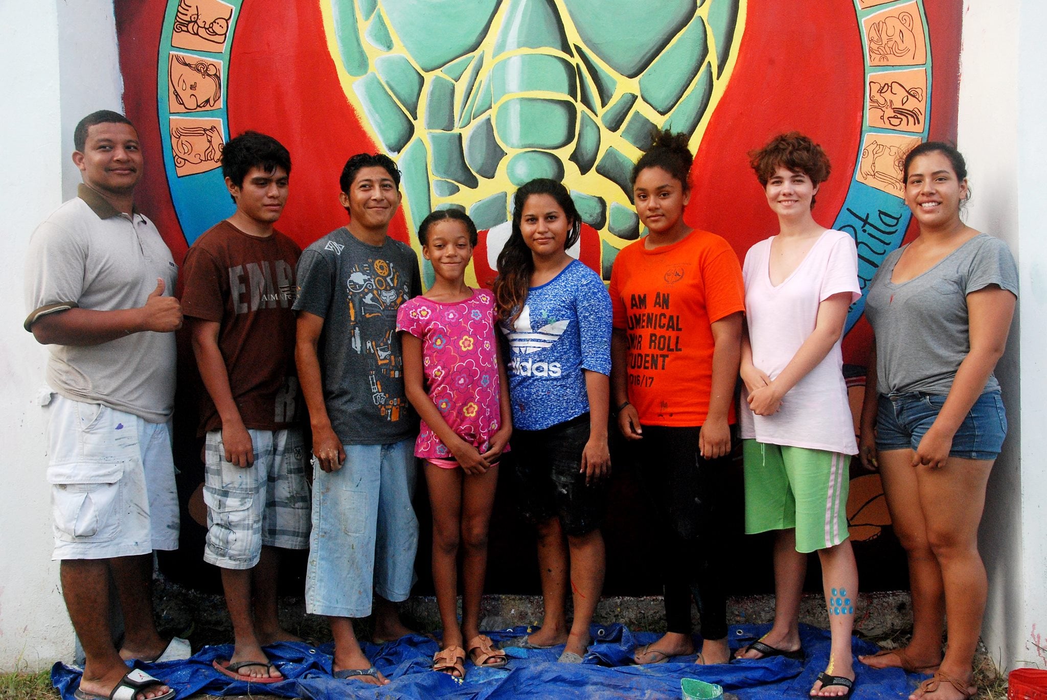 Kelvin Baizar left with mural students in Corozal